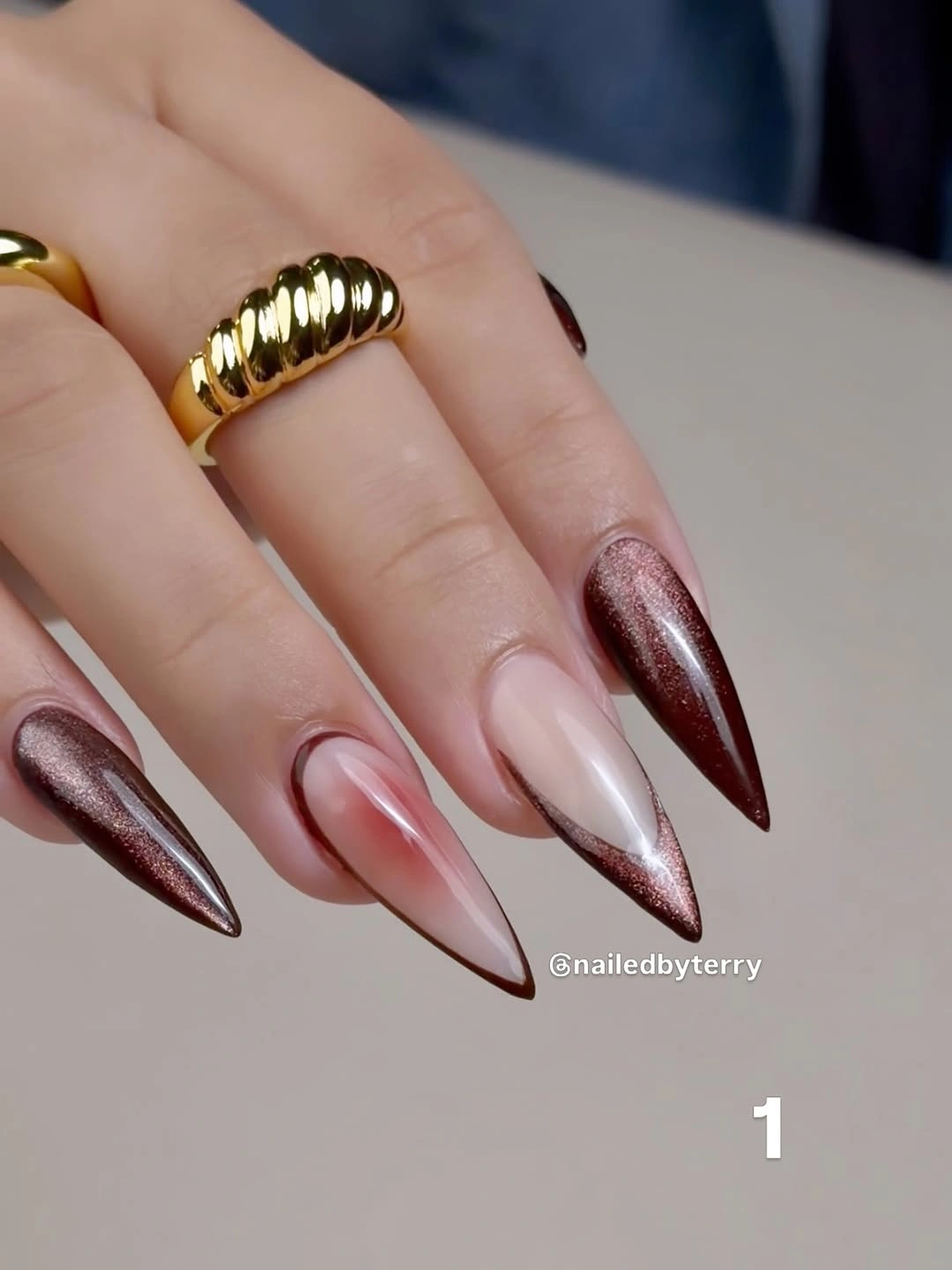 Long almond nails with mauve white and metallic brown tips