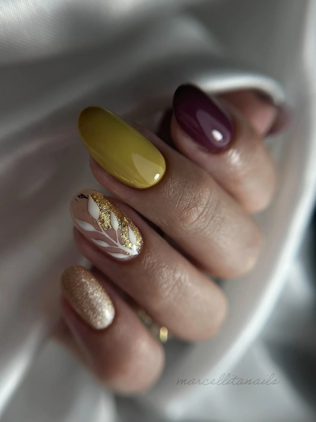 Short rounded nails mixing mustard burgundy blush floral and gold accents
