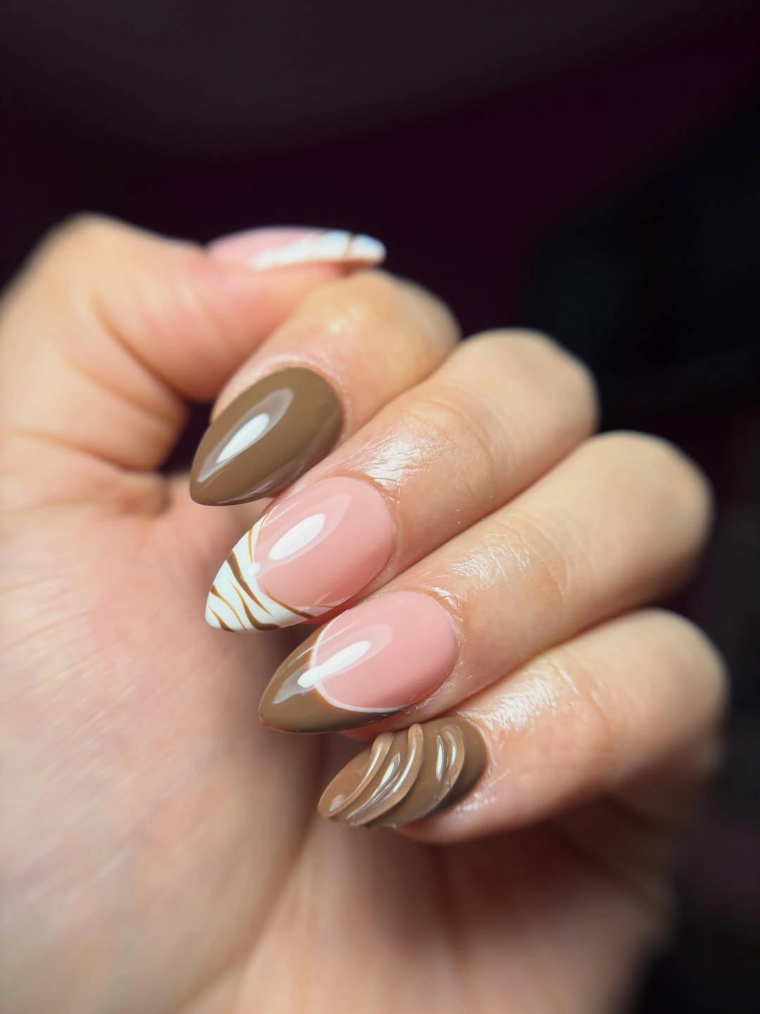 Muted taupe and olive almond nails with curved white accents