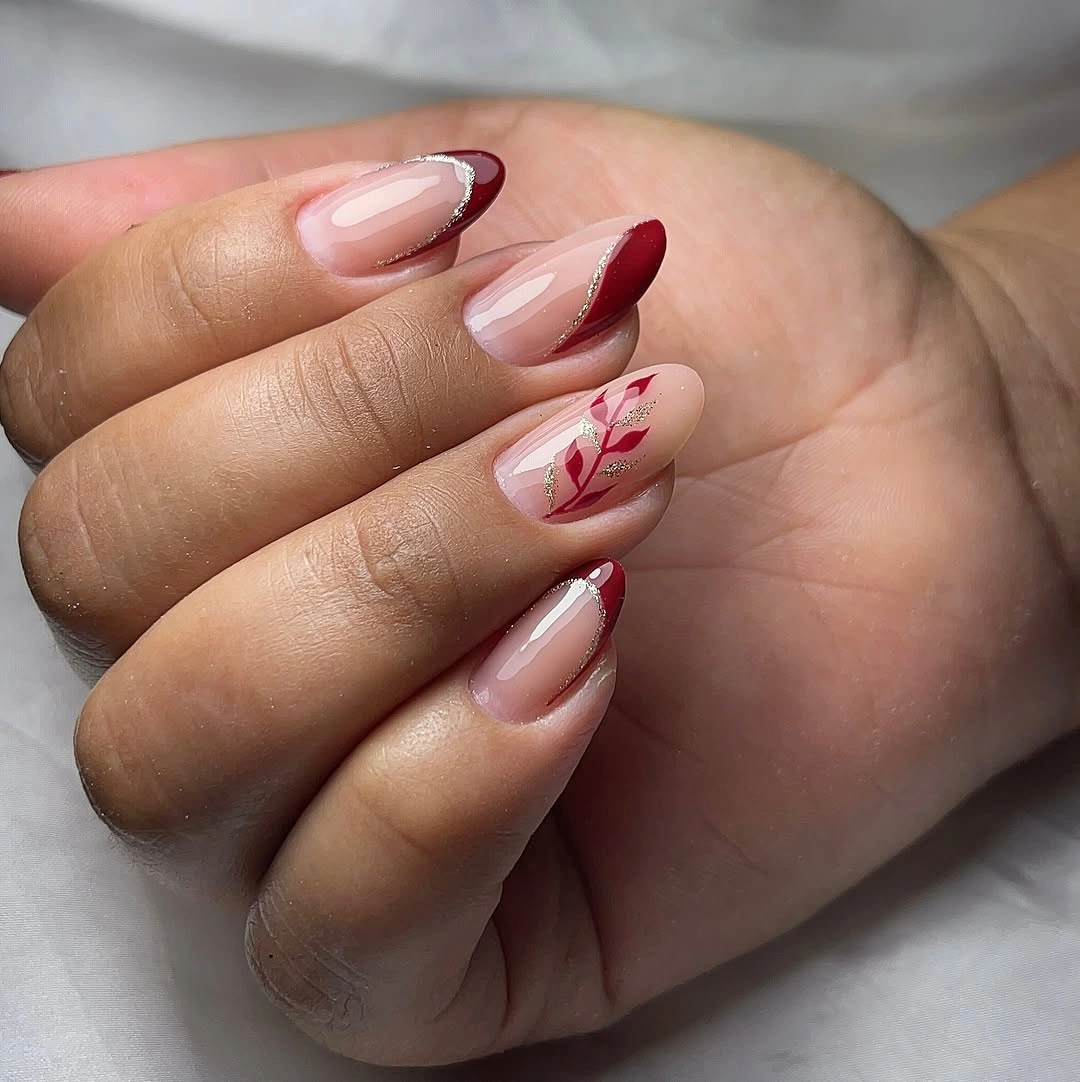 Pink almond nails with wine tips and delicate curved line art