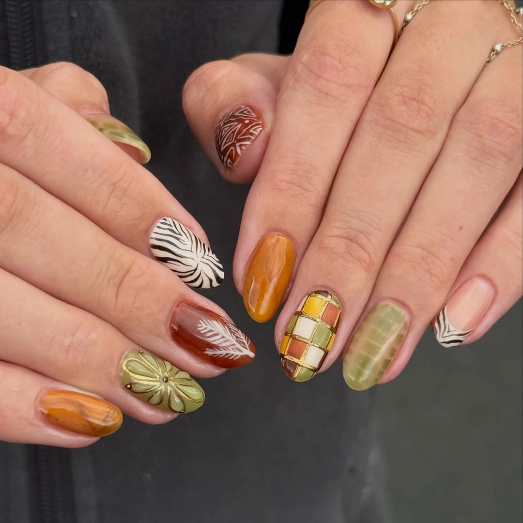 Mixed autumn almond nails with plaid and leaf-like details
