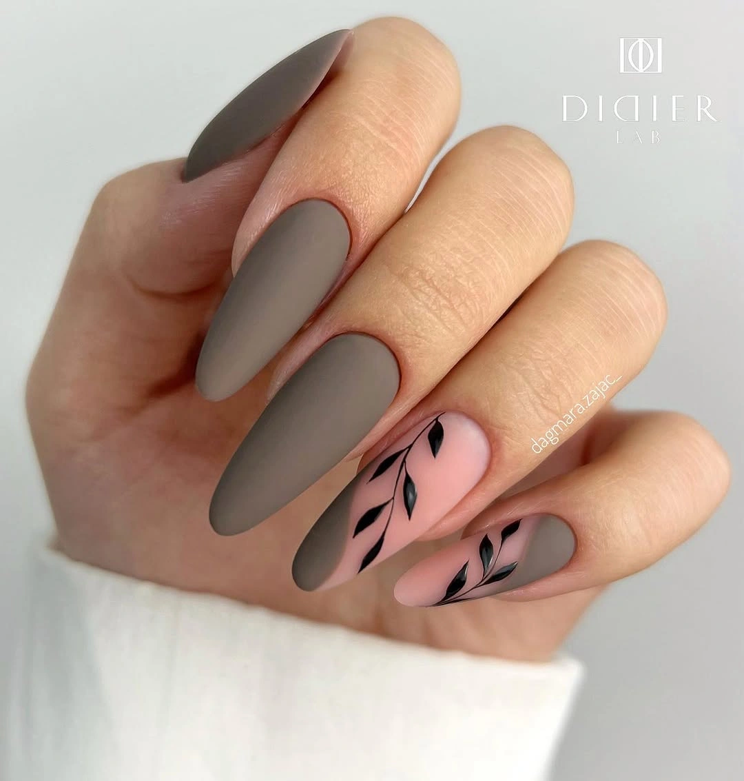Long taupe matte nails with pink panels and black botanical lines