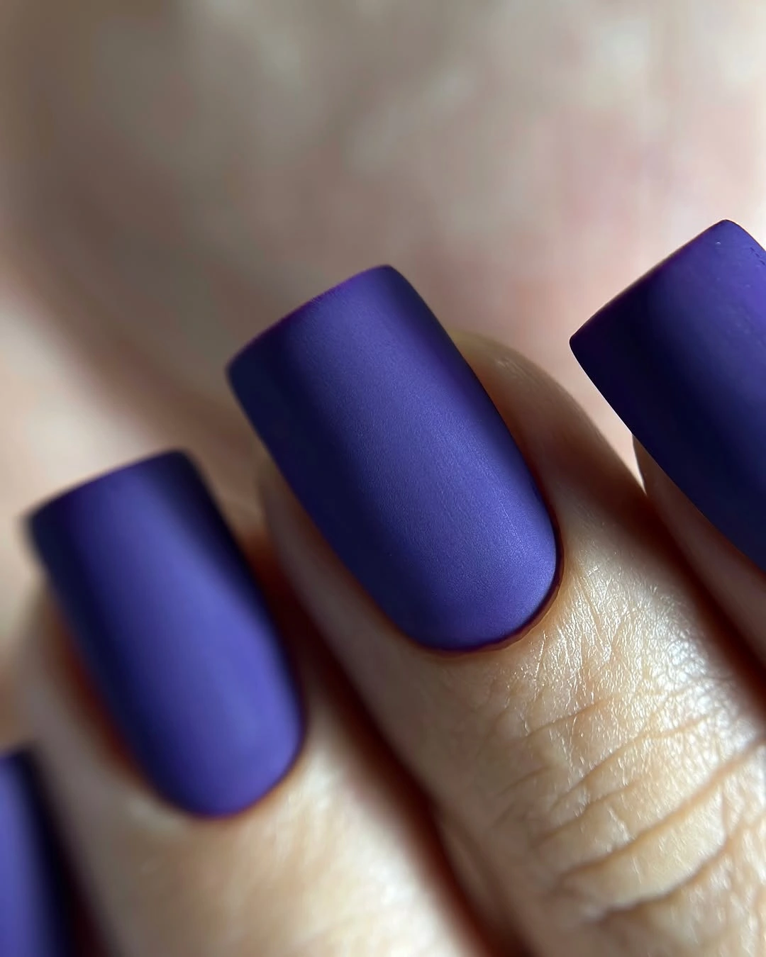 Short square nails in a saturated matte indigo purple shade