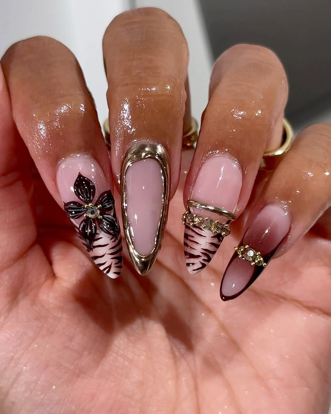 Almond nails with black white striped tips and dark accents