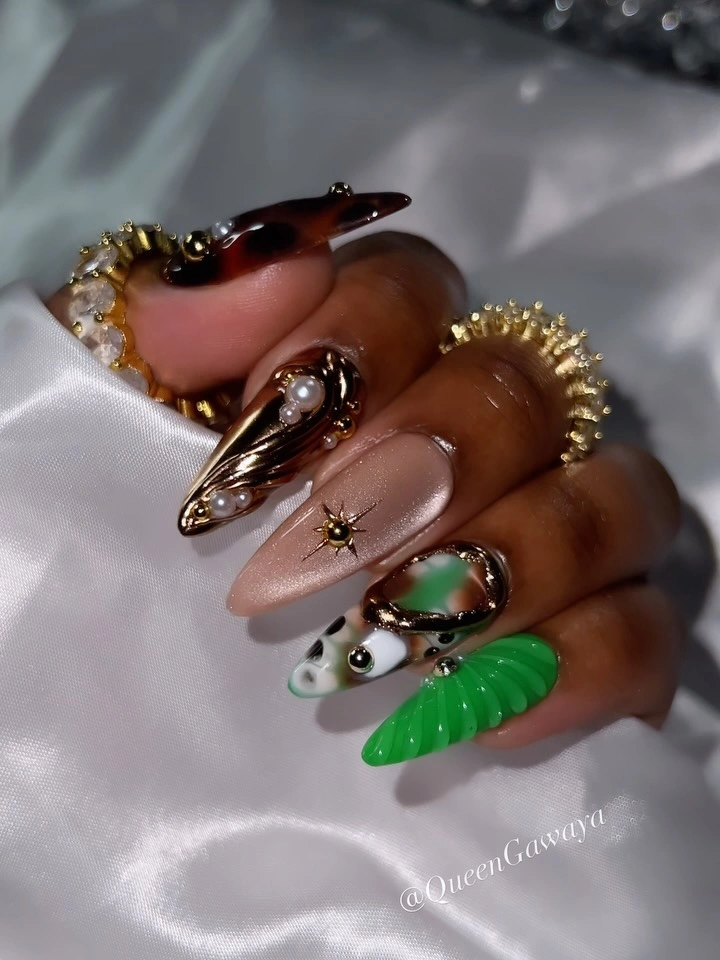 Almond nails with dark brown tips and one vivid green accent