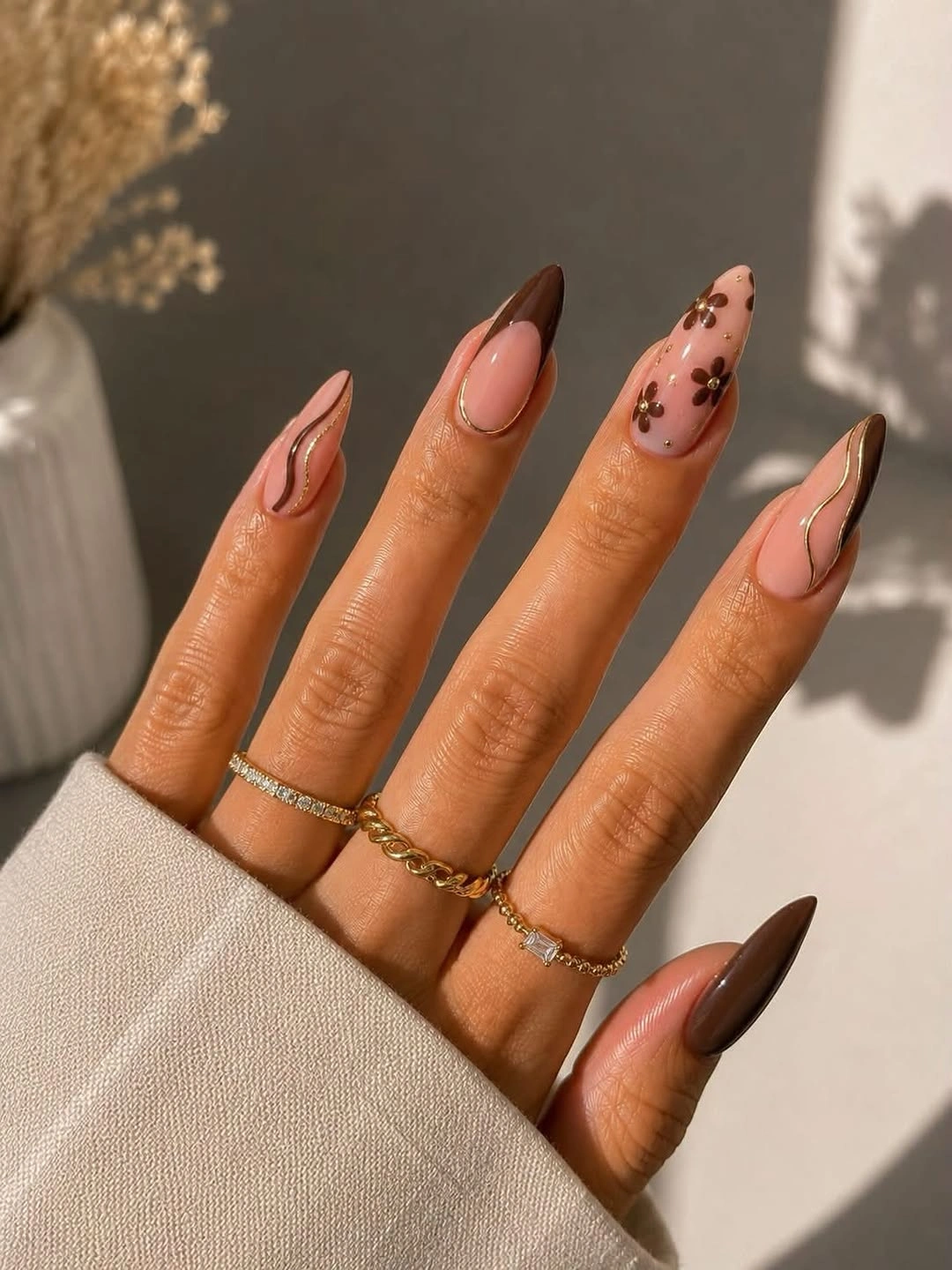 Pointed brown fall nails with swirls and leopard spots