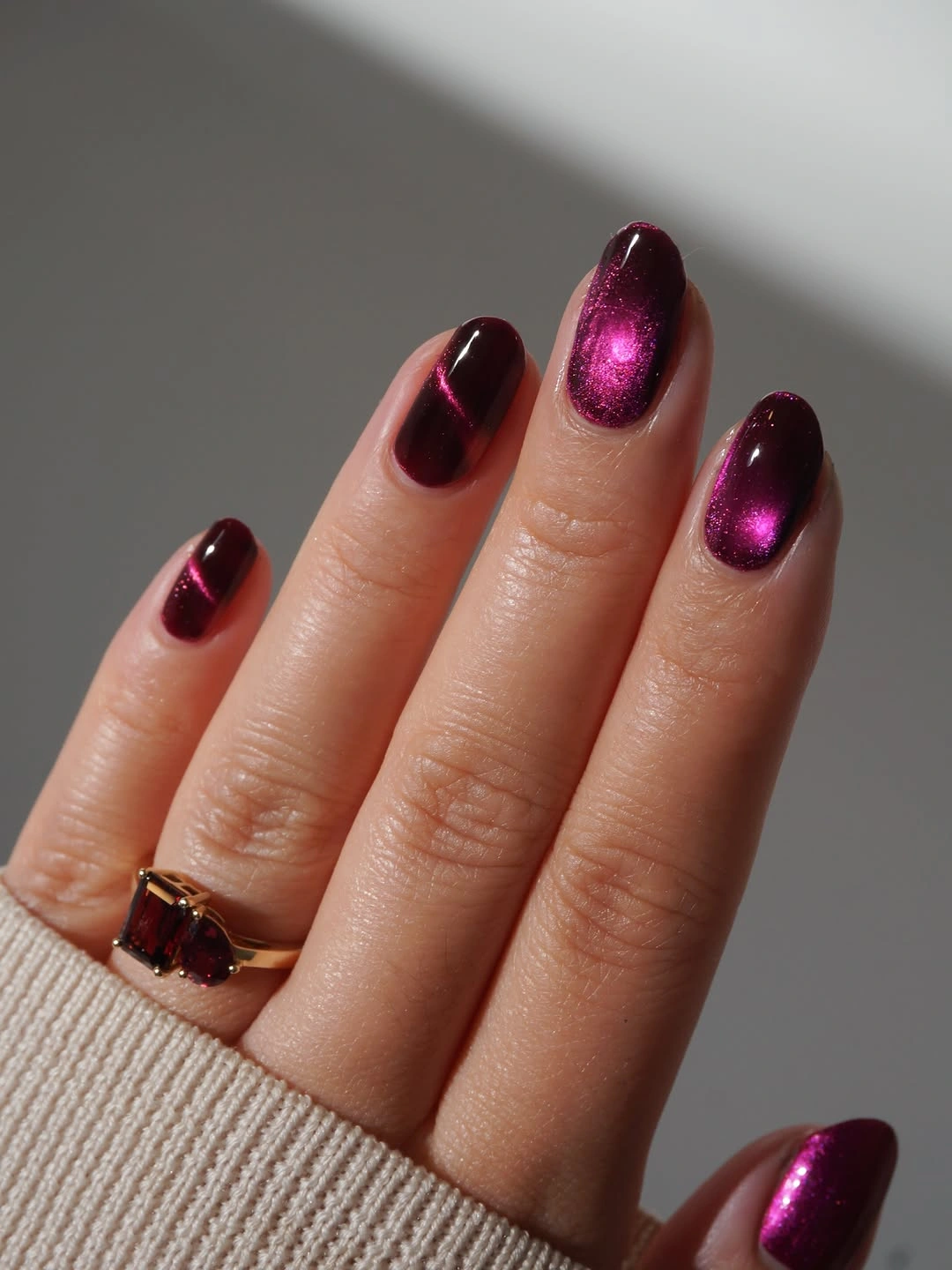 Glossy plum medium nails with reflective fall shine