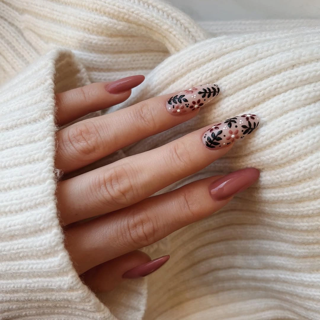 Medium almond nails with dusty rose and selective monochrome art