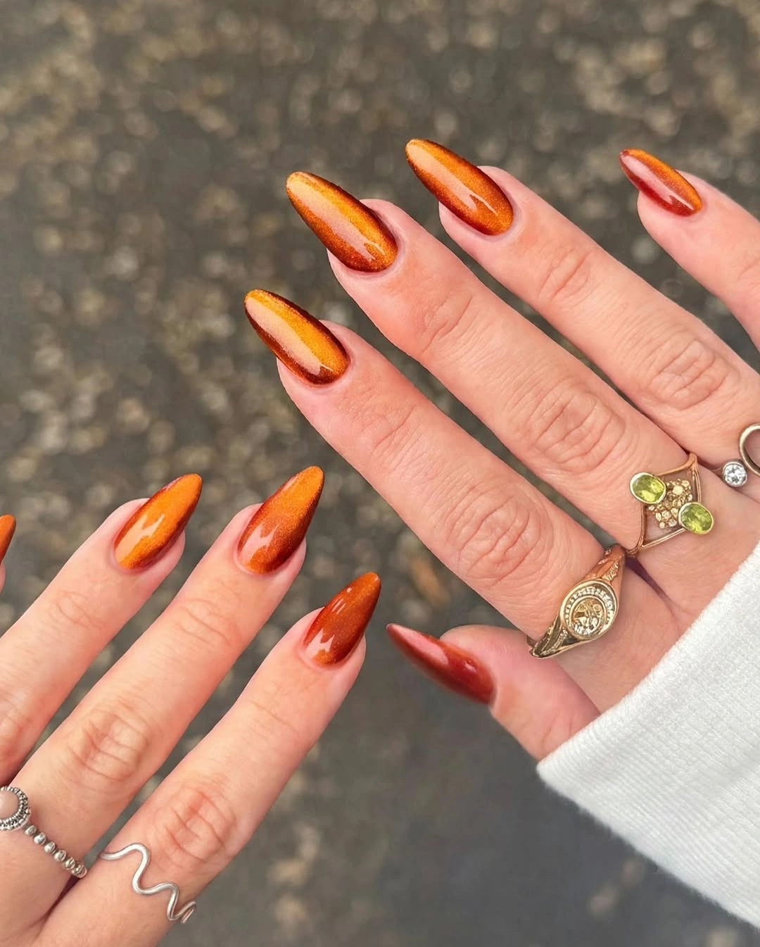 Long almond nails with bright orange red yellow and pink tips