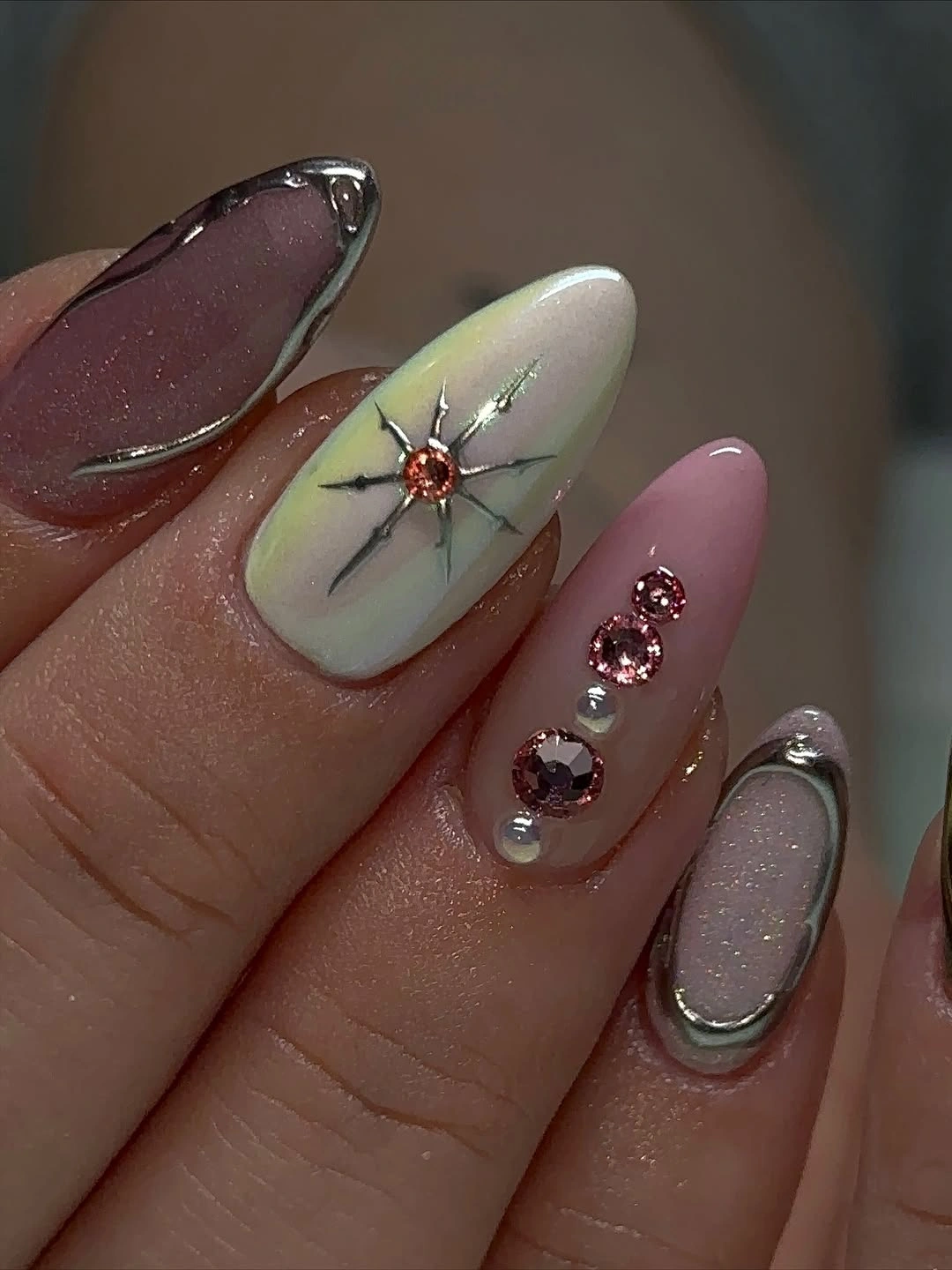 Medium almond nails with mauve green plum and silver details