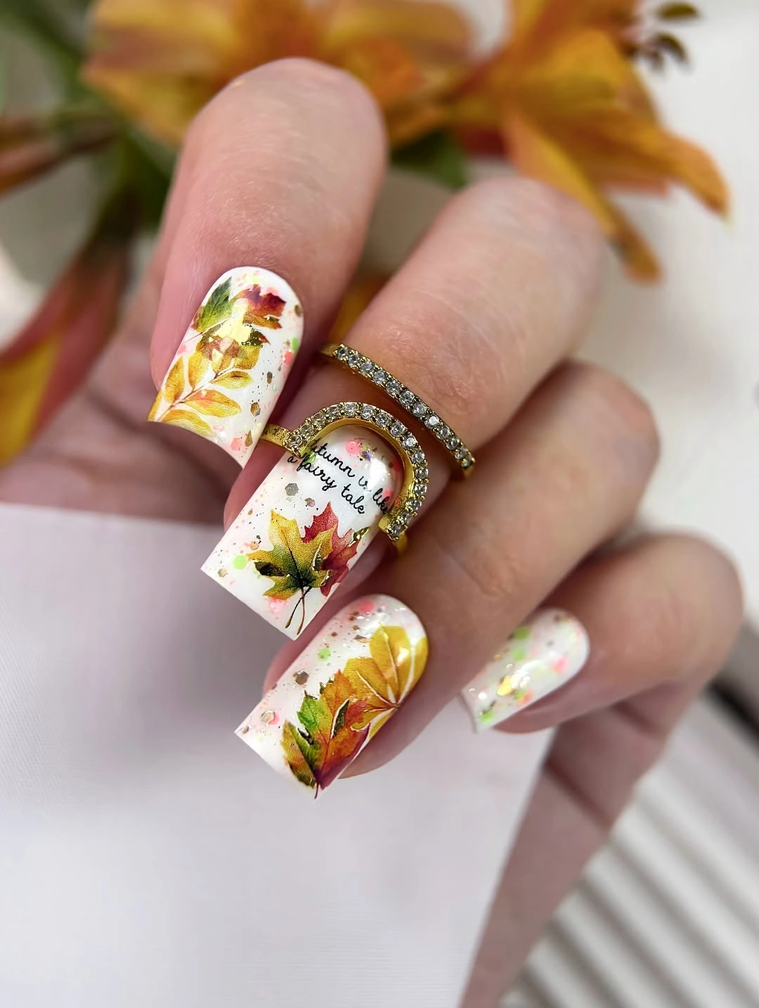 Long square pale nails with yellow green botanical collage