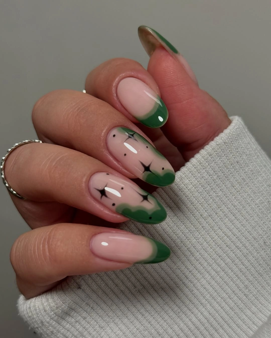 Long almond pale pink nails with forest green tips