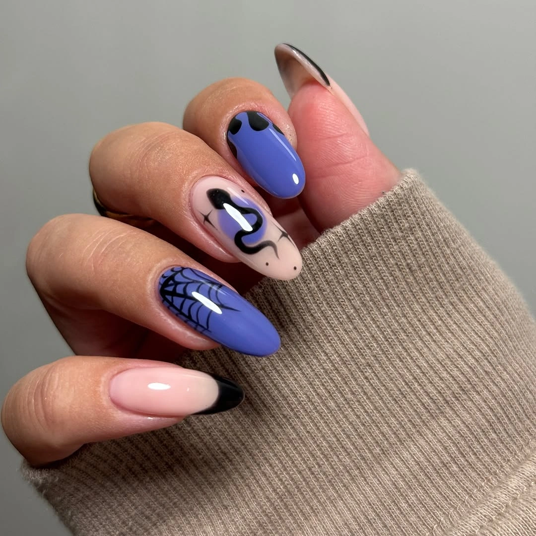 Long almond pale nails with blue violet curved accents