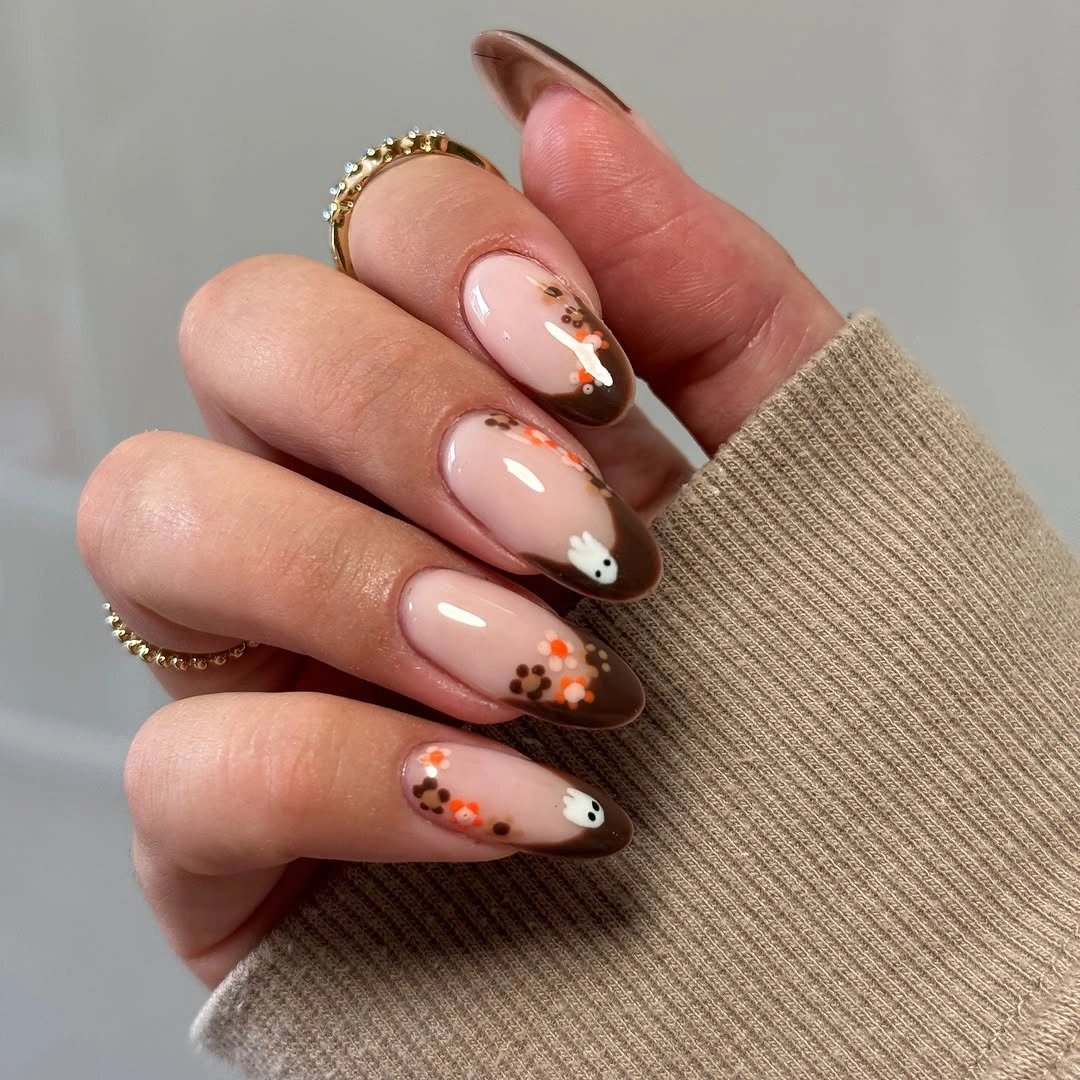 Medium almond blush nails with brown orange and gold accents