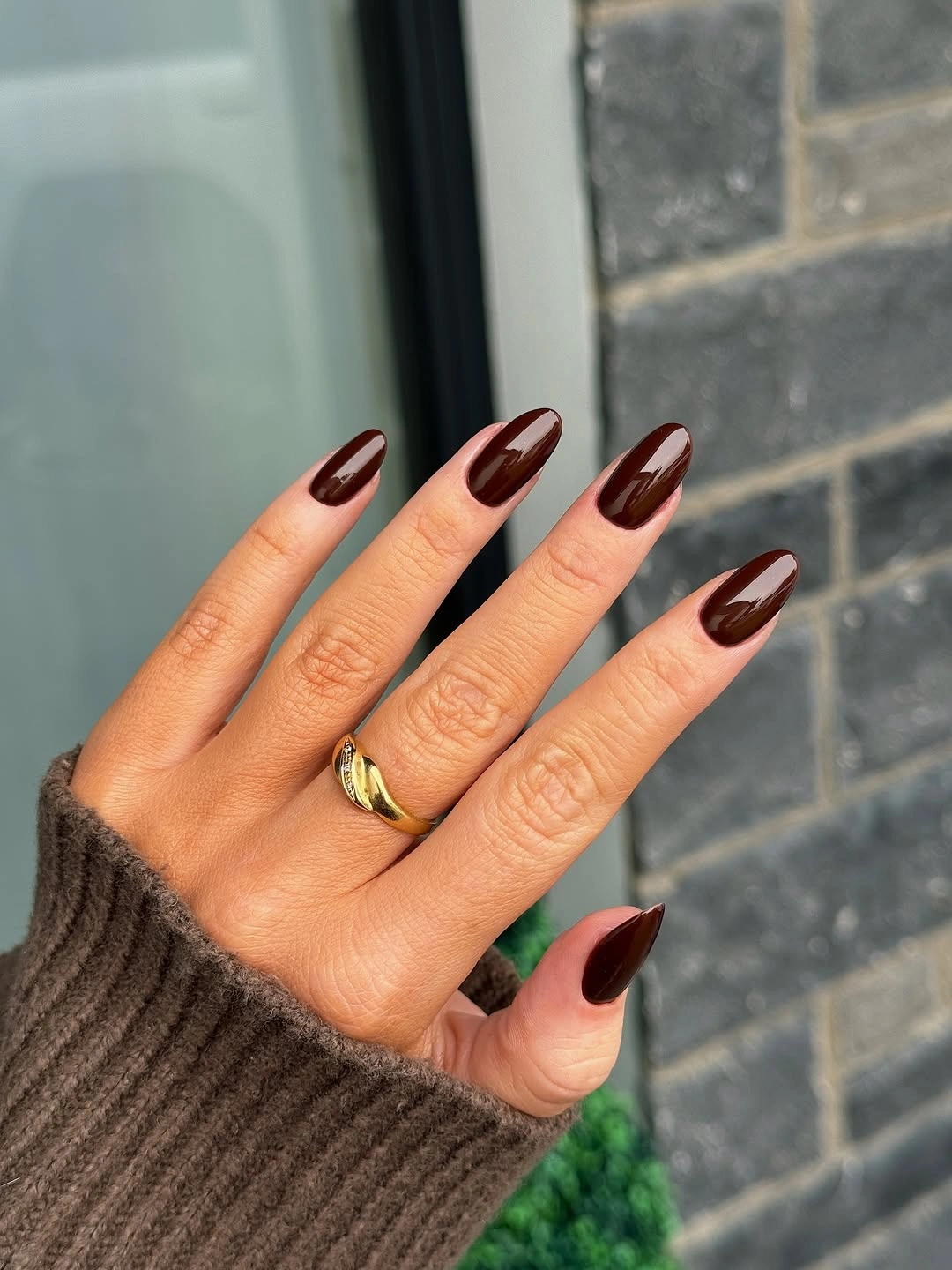 Chocolate almond nails with pale curved accents