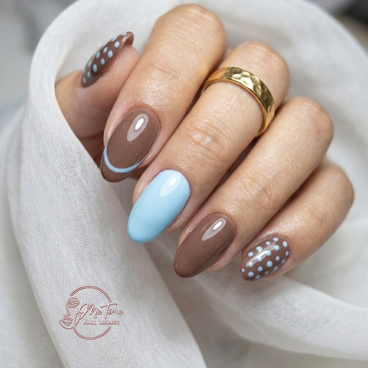 Taupe brown almond nails with pale blue accent