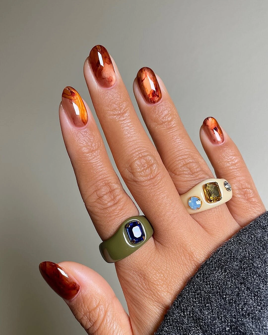 Caramel tortoise tips on nude almond nails