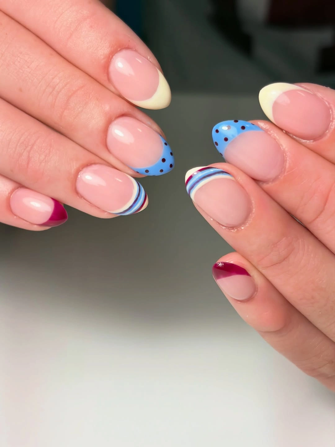 Cream French tips with tiny blue dotted borders