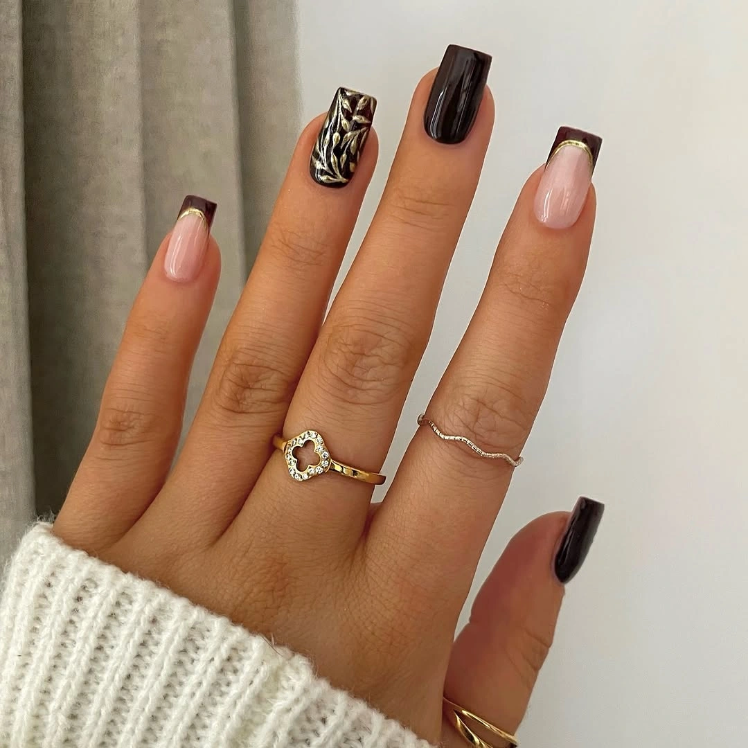 Medium square nails with black tips and selective pattern accents
