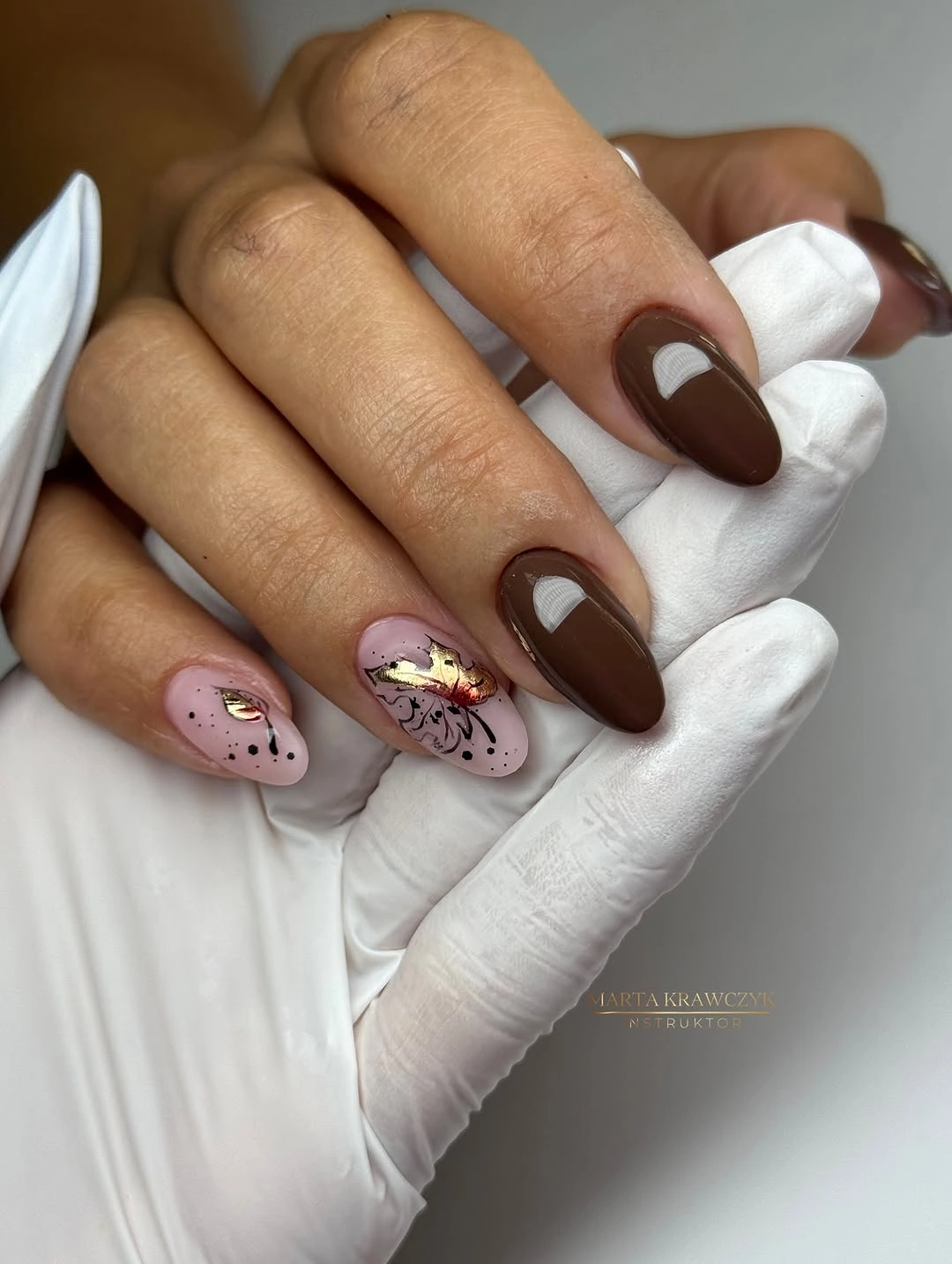 Medium almond nails with chocolate brown solids and gold accents