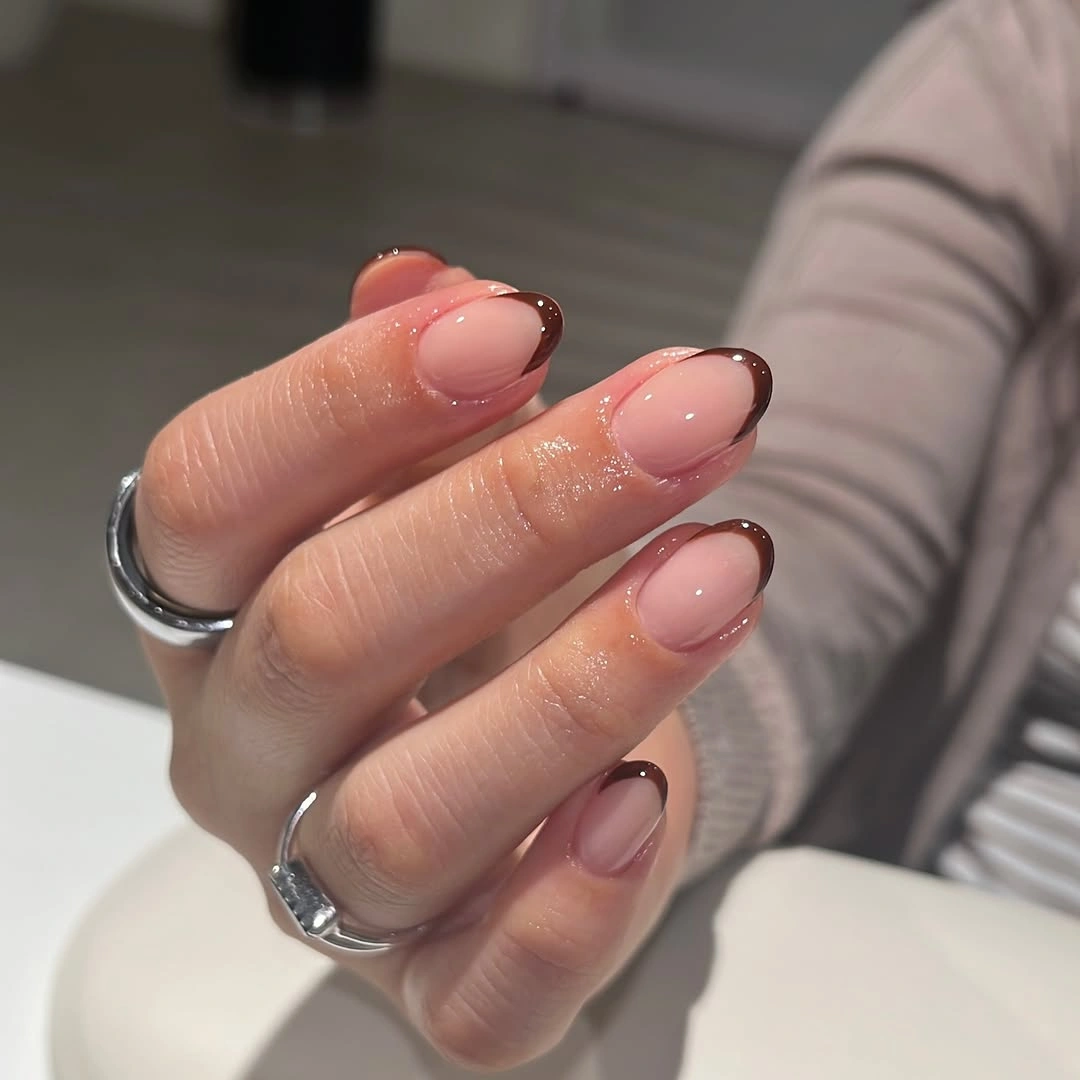 Medium almond nails with double-lined dark French edges