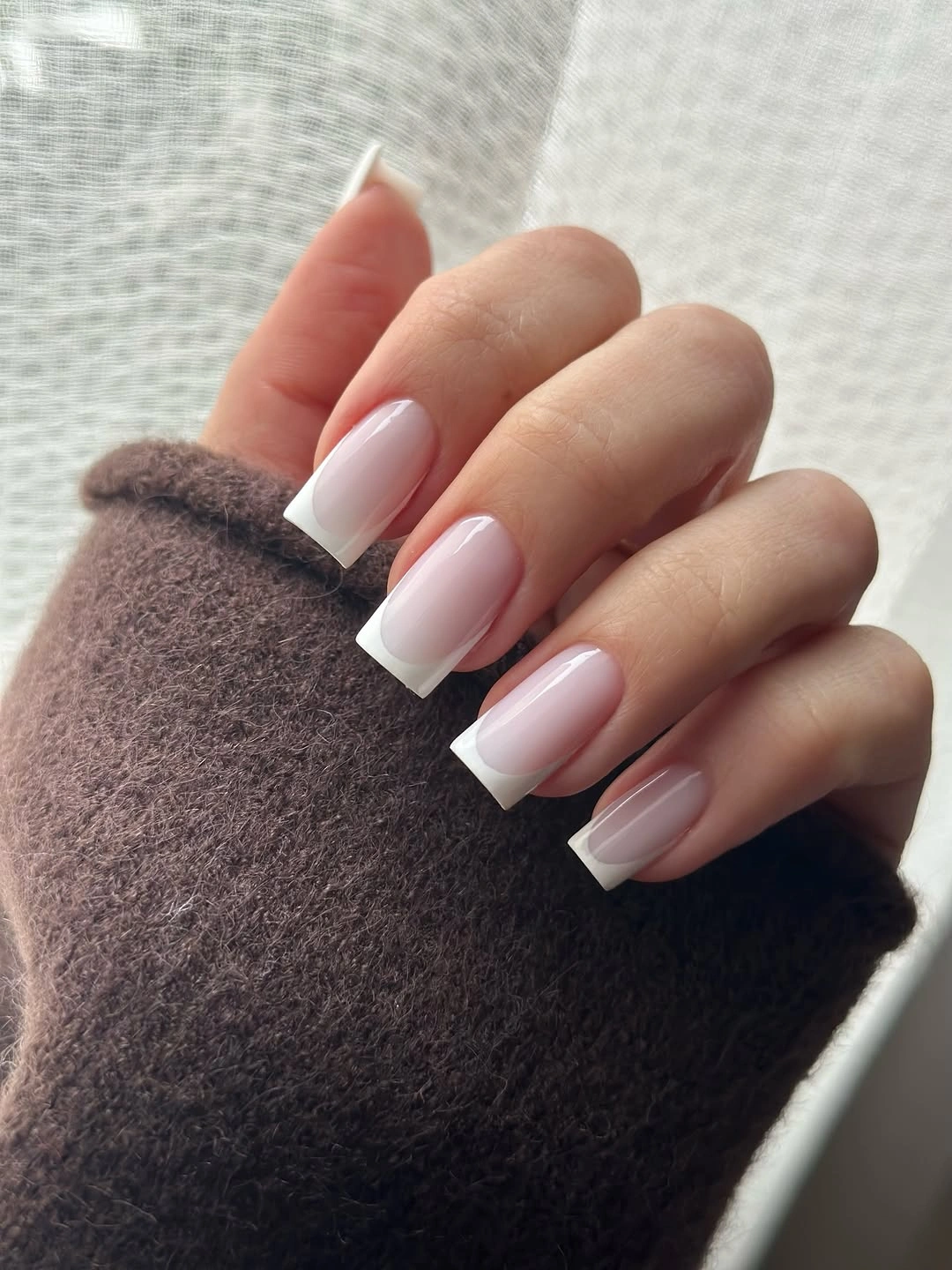 Long square nails with brown white nude and patterned accents