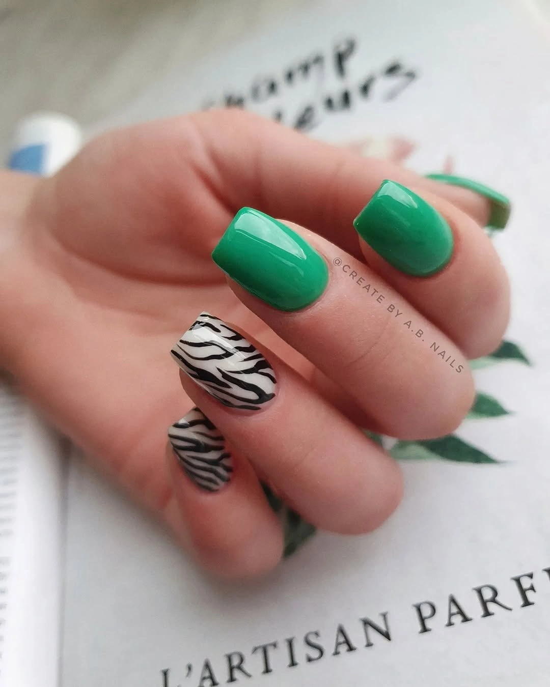 Long square nails with blue nude and geometric accent details
