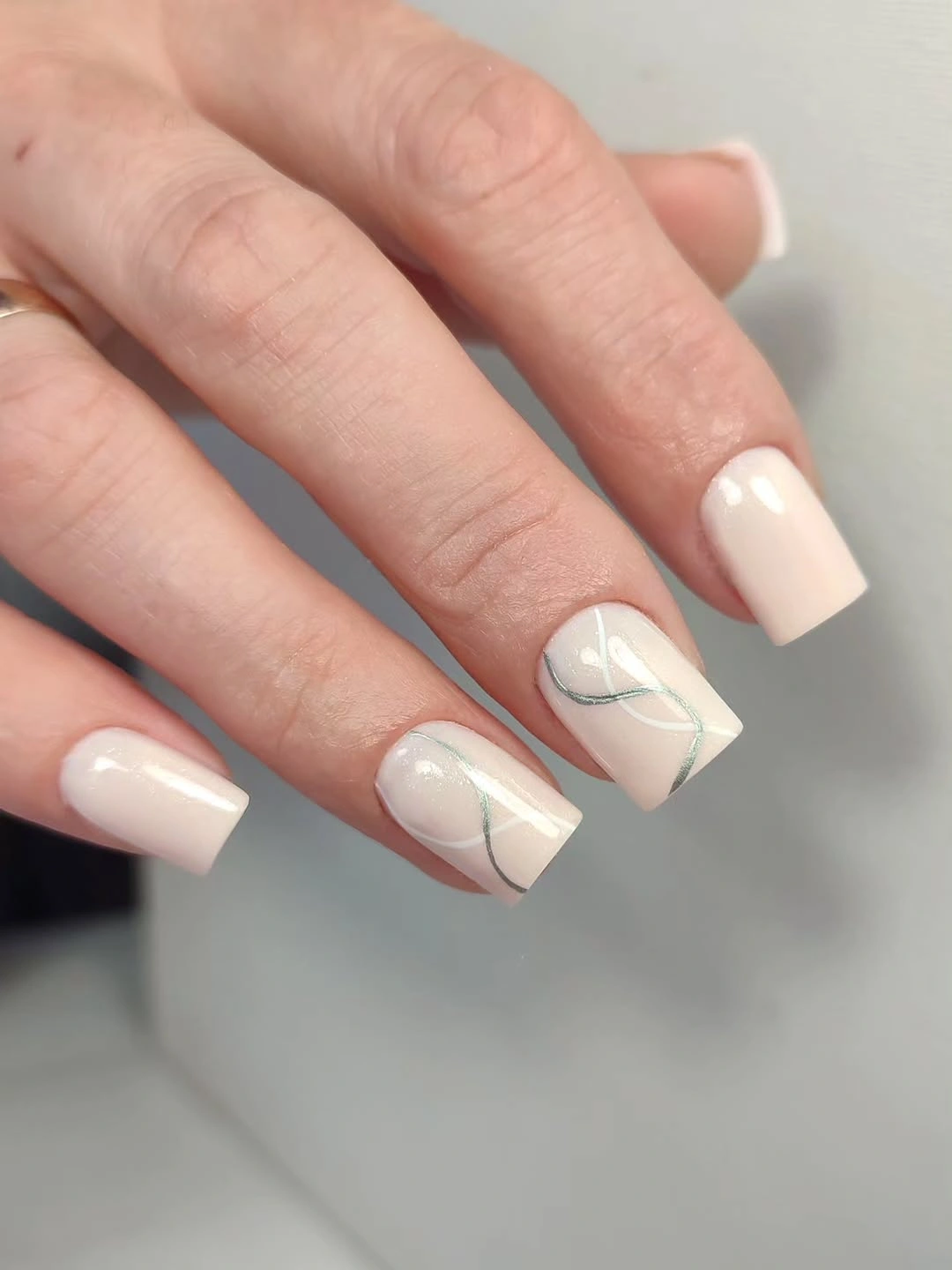 Short square nails with burgundy solids and cream spotted accents