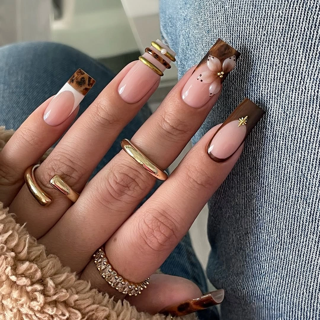 Medium square nails with spotted white French tips and nude centers
