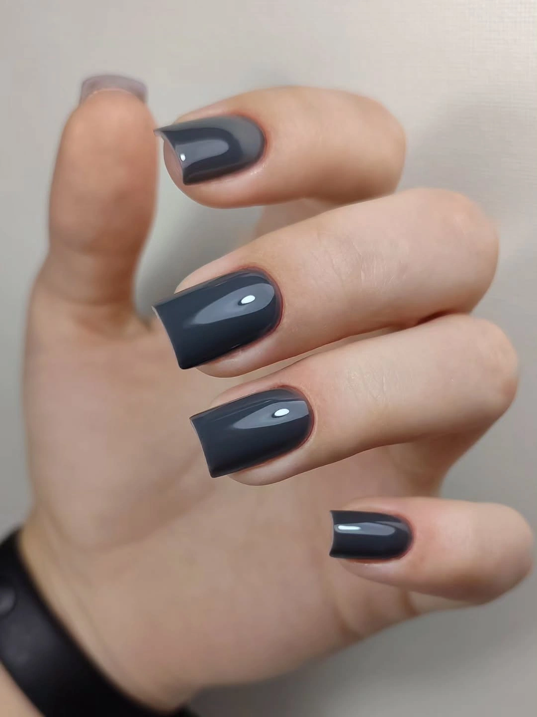 Short square nails with vivid blue solids and dotted nude accents