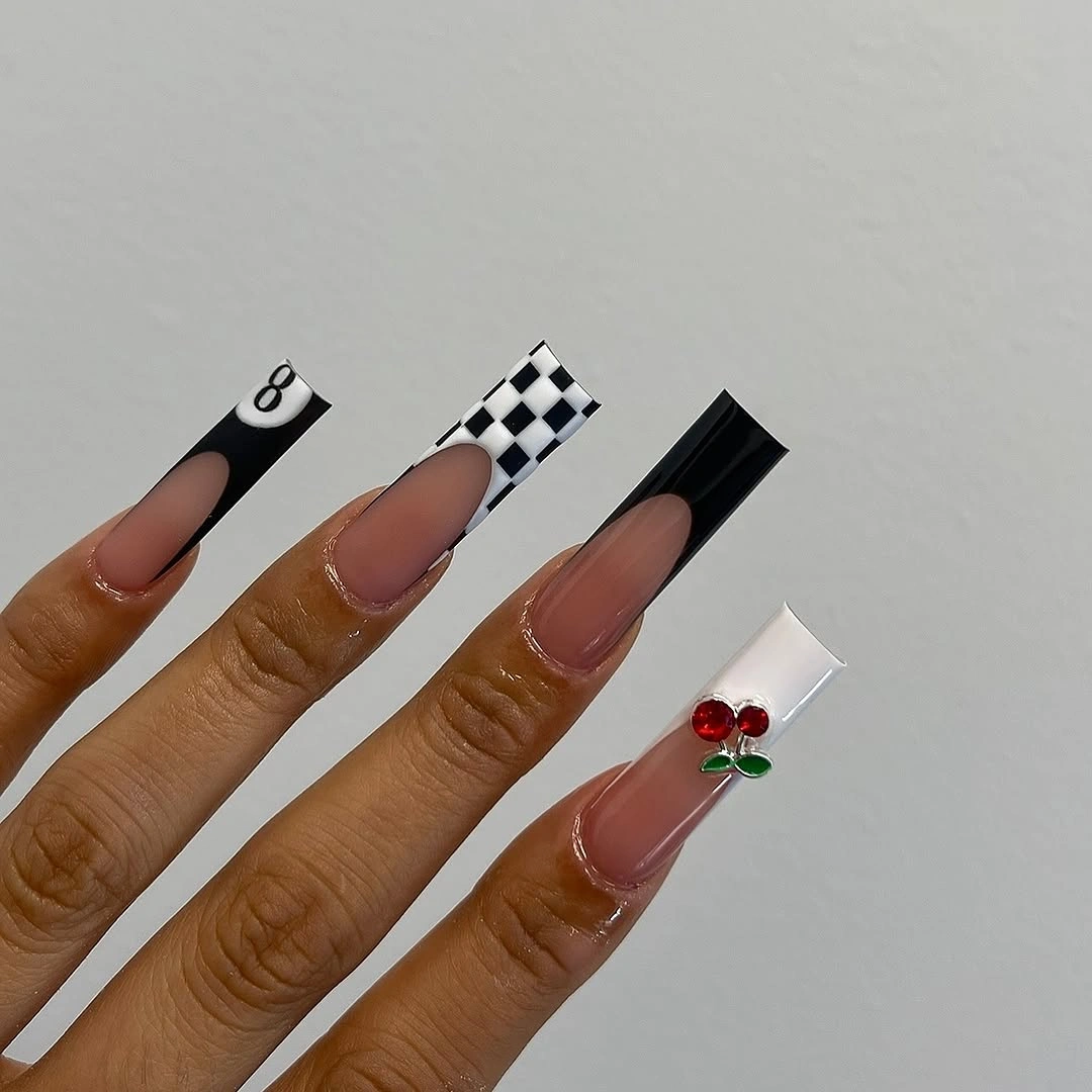 Long square nails with black contrast and a nude framed accent