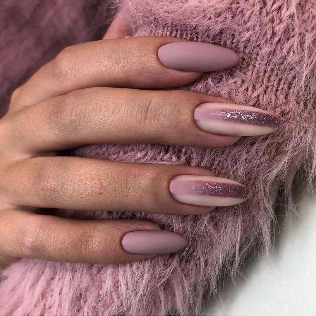 Dusty mauve almond nails with soft glitter gradients