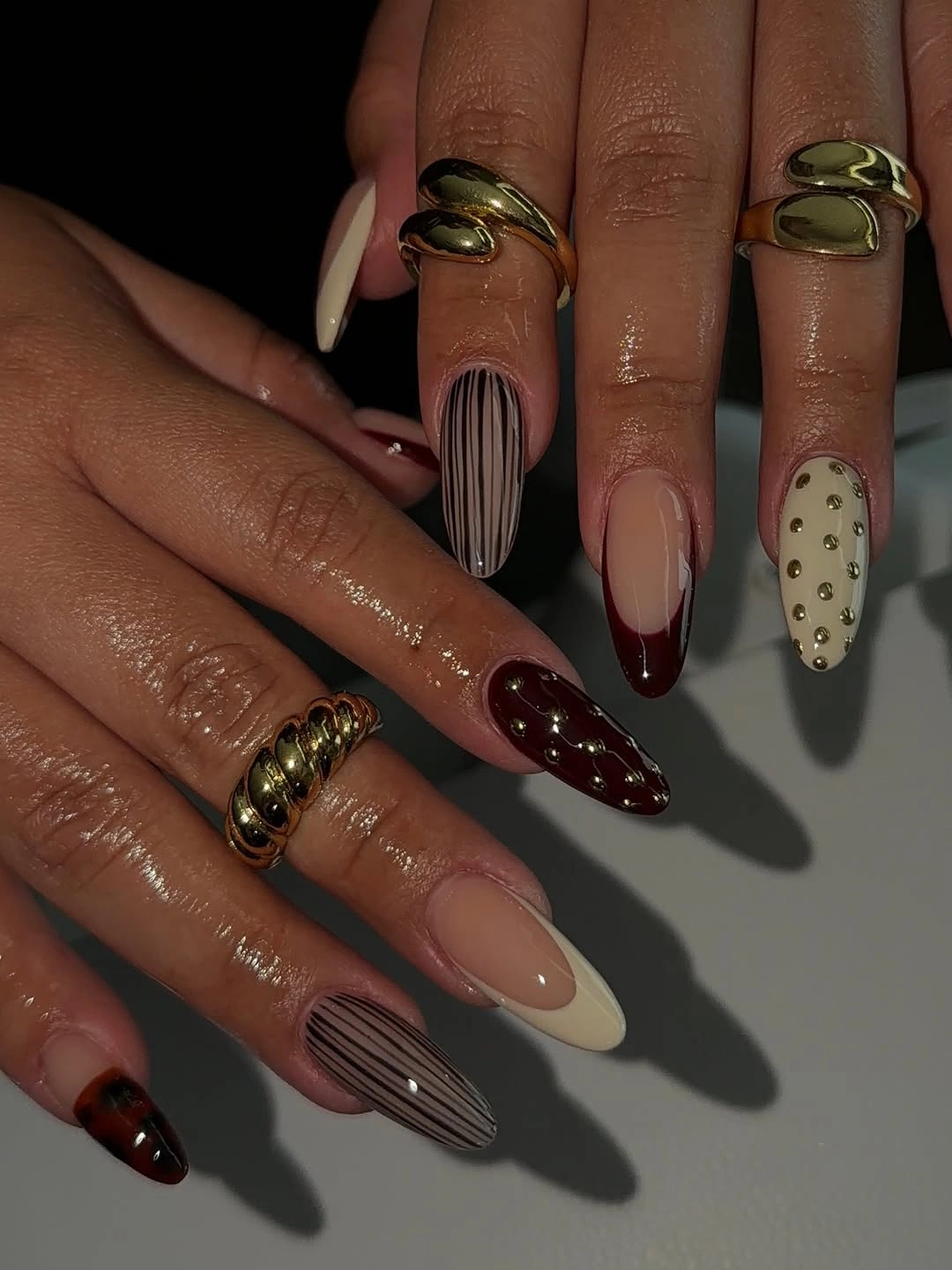 Long almond nails with sheer nude and tortoiseshell accents