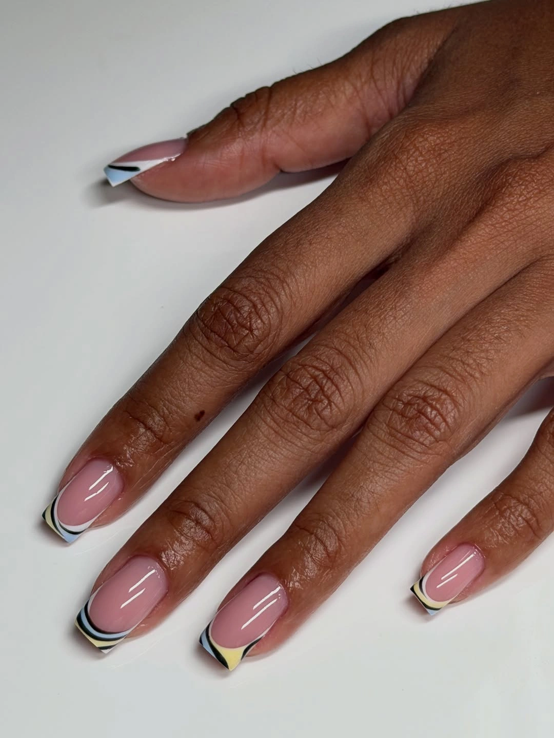 Medium almond nails with slim graphic French lines
