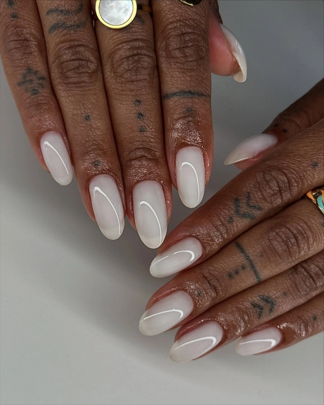 Milky white almond nails with glossy clean finish