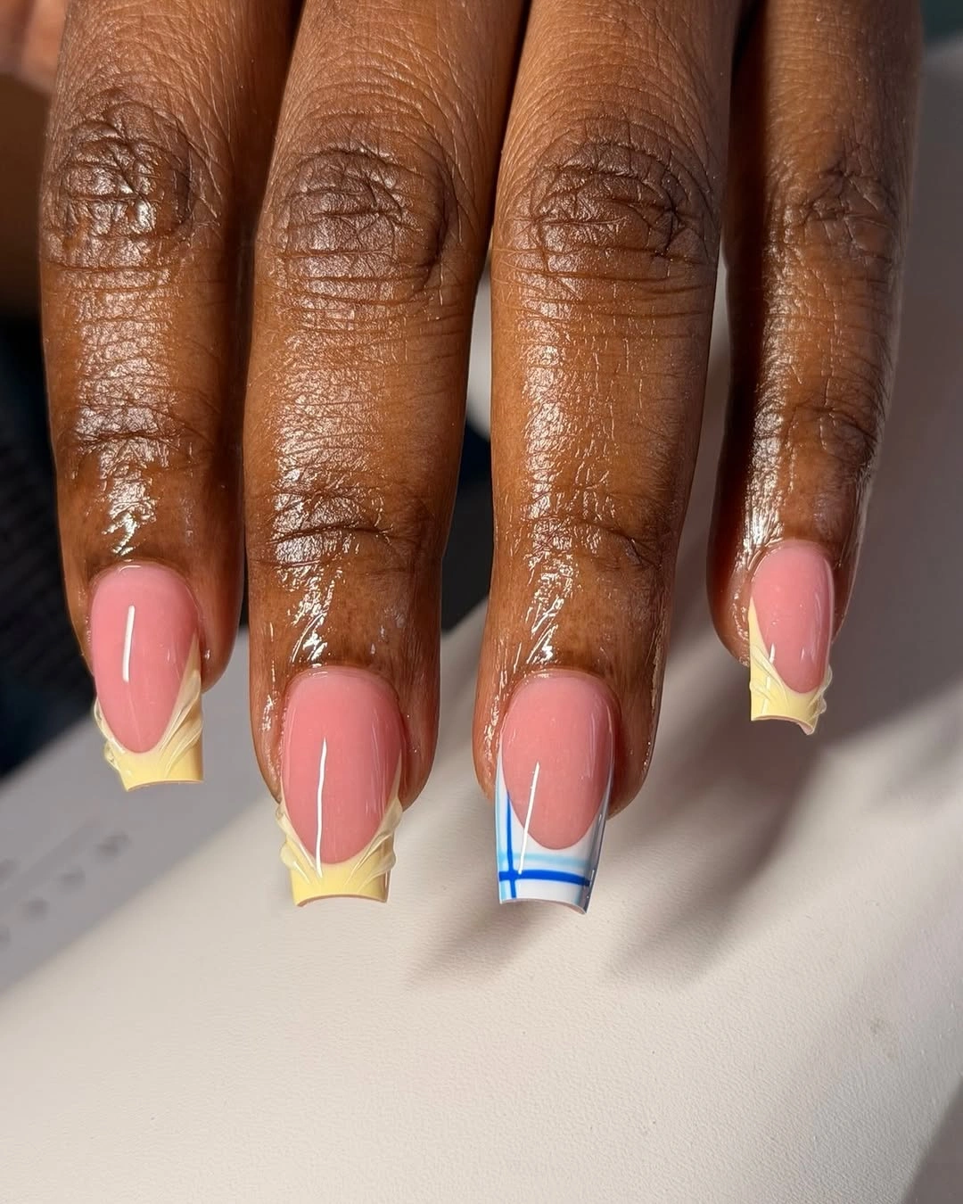 Clear square tips with yellow corners and blue lines