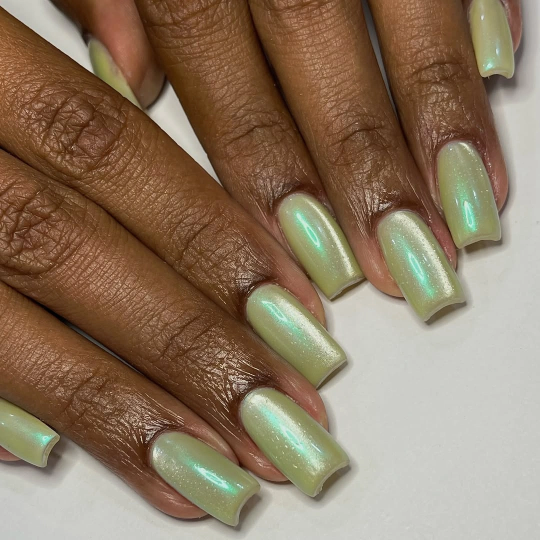 Pistachio pearl square nails with aqua shimmer