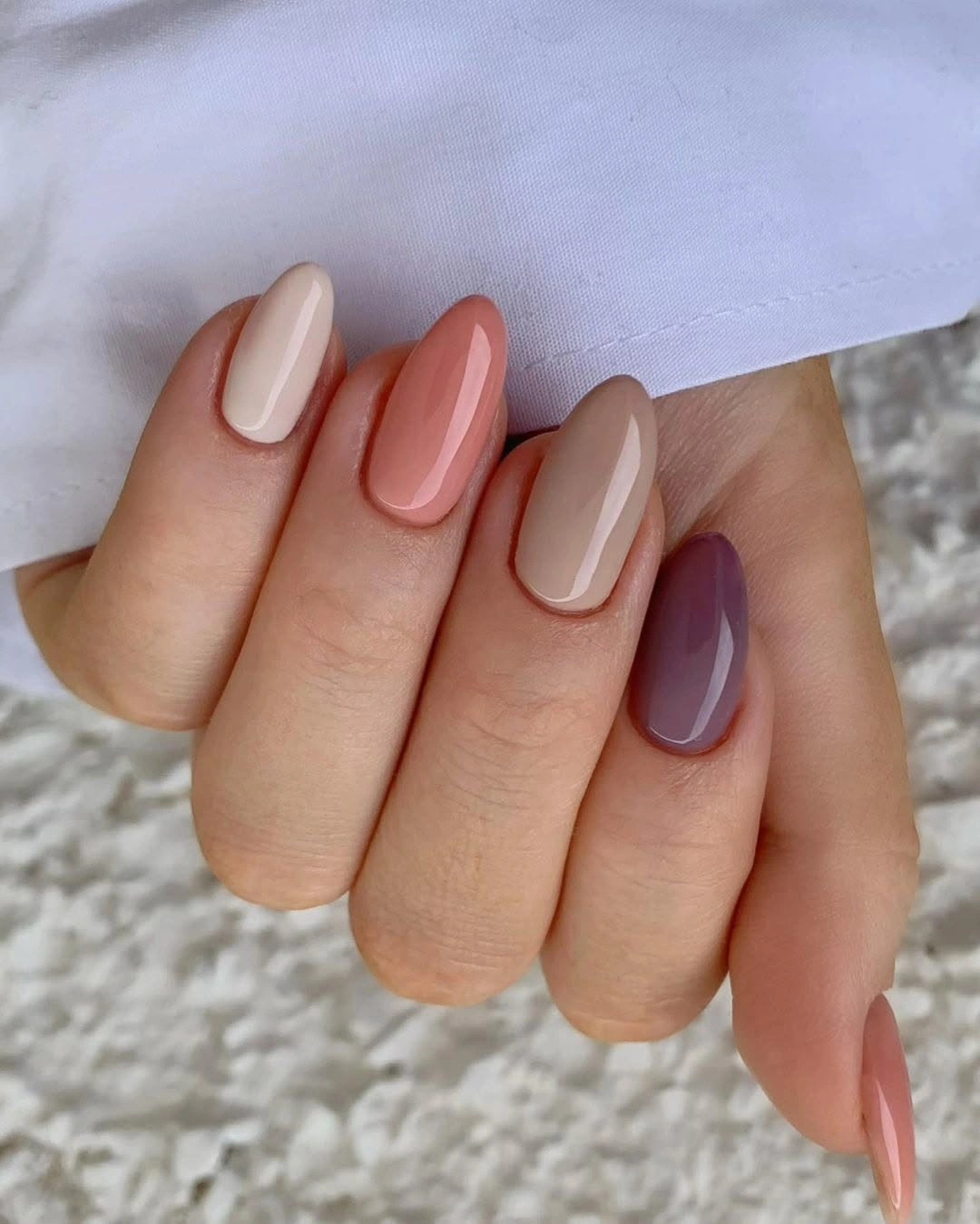 Medium almond nails in cream peach dusty pink and muted purple solids