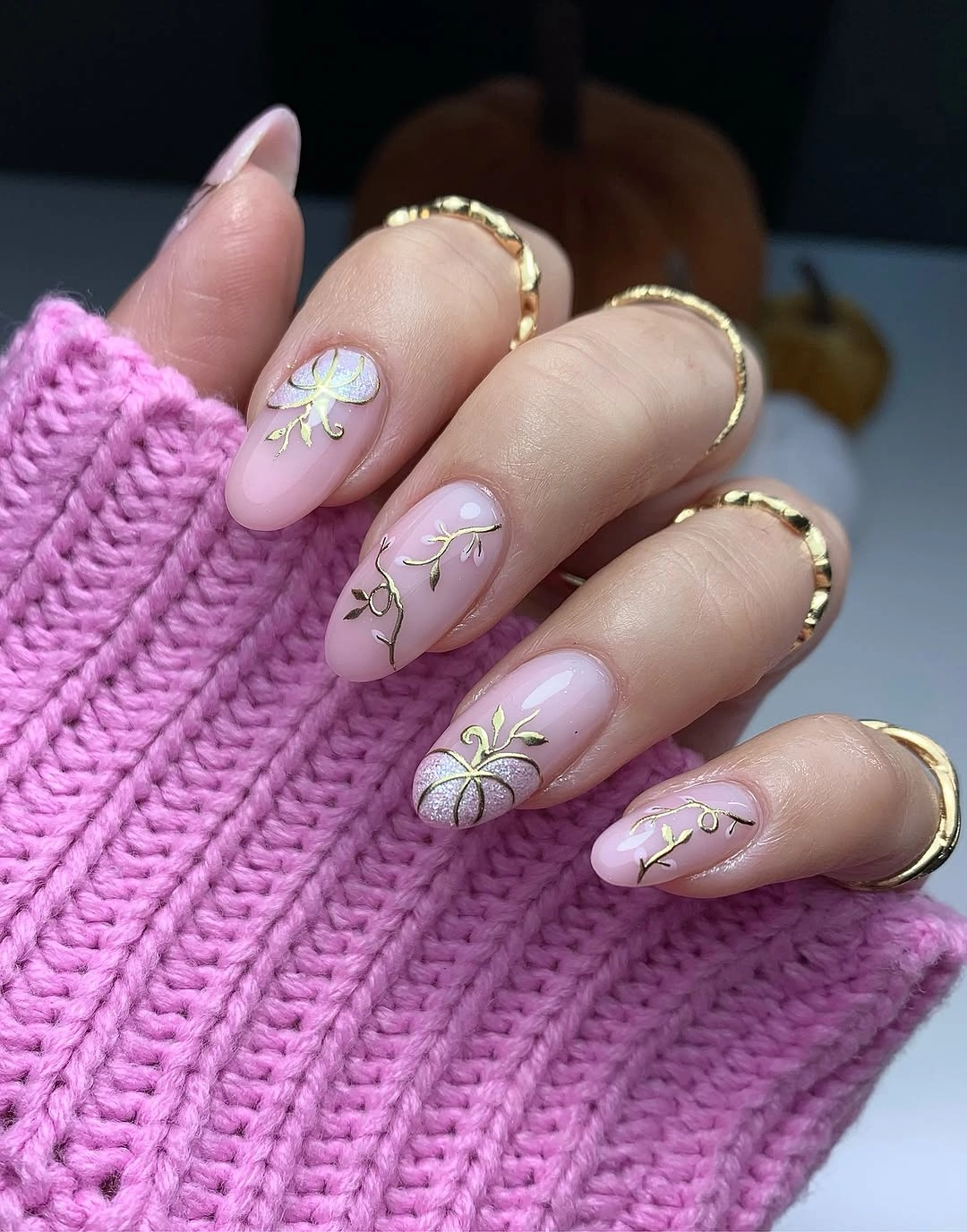 Dusty lilac almond nails with fine white flowers and green stems