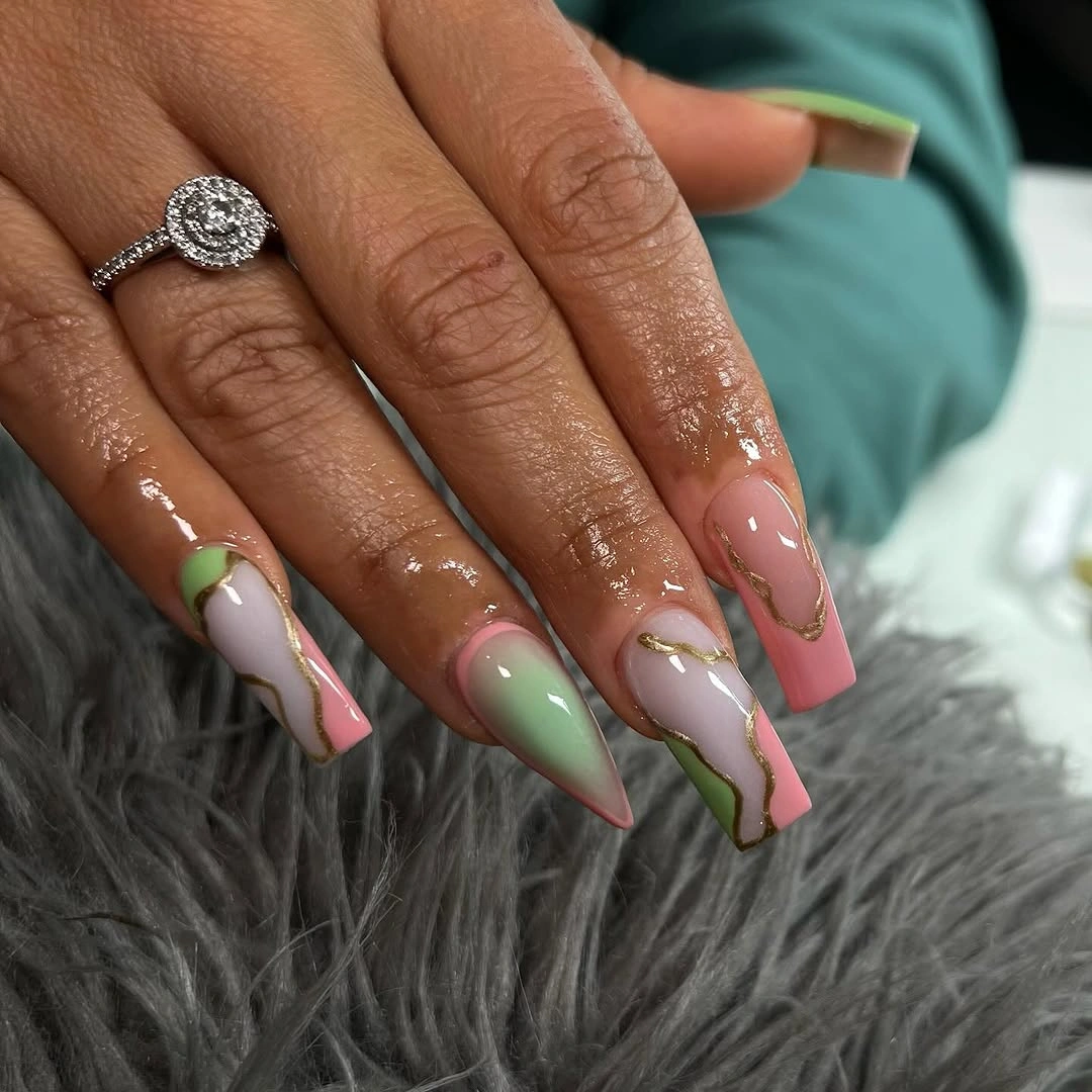 Long pink and green French nails with wavy outlined borders
