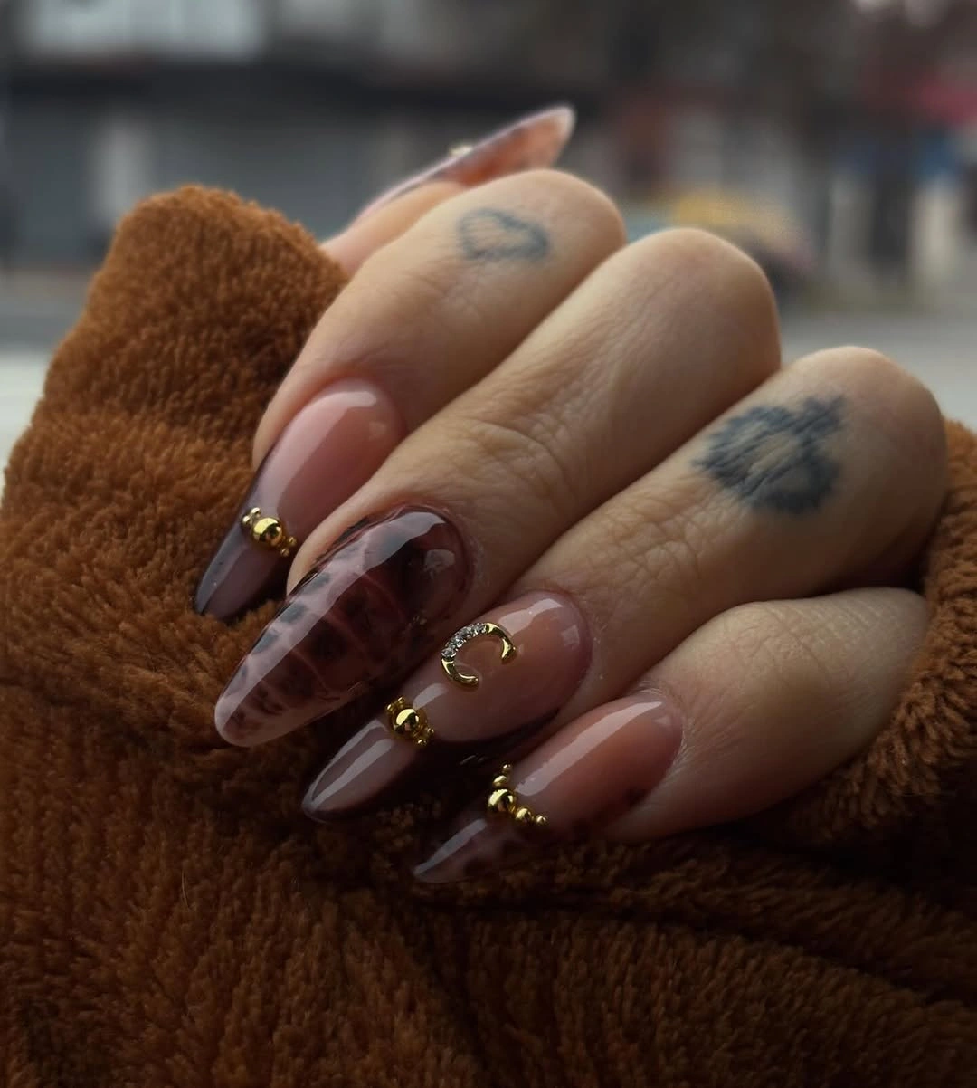 Long almond nude and cocoa brown nails with fine plaid accents