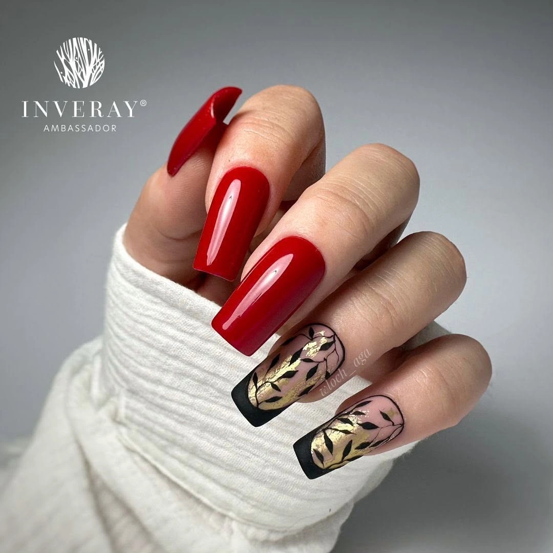 Bright red coffin nails with black botanical nude accent nails