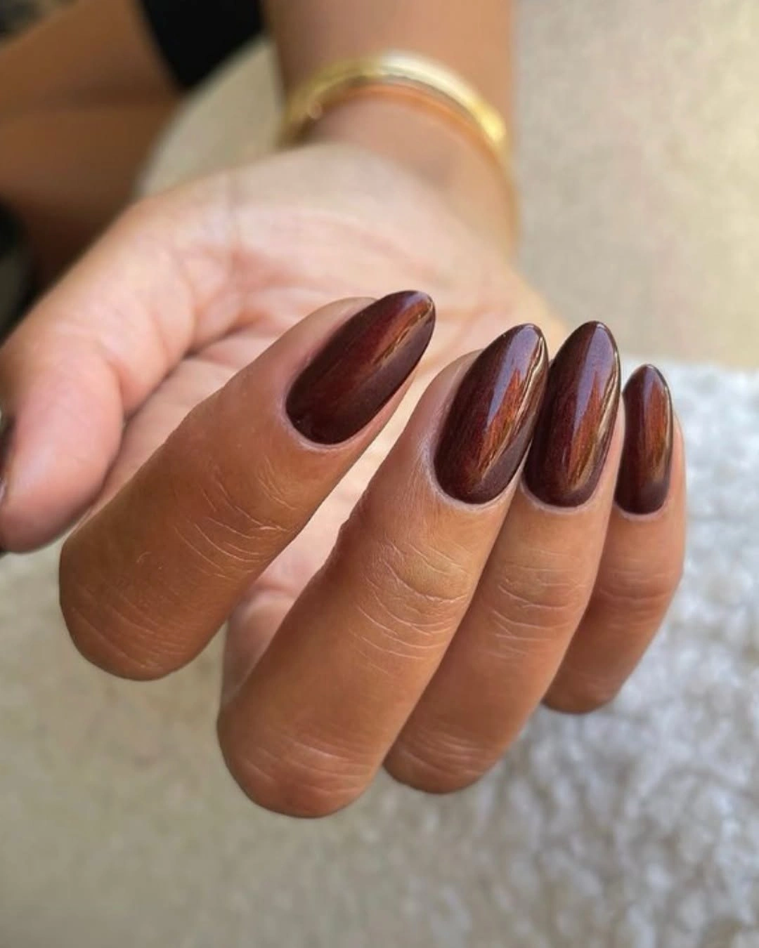 Long almond deep brown nails with coppery metallic reflective sheen