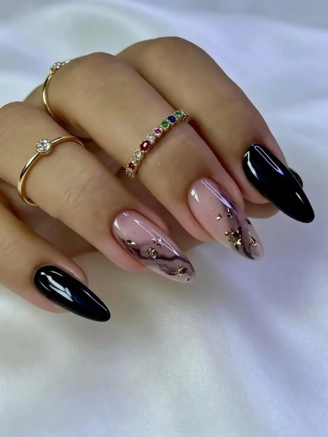 Long almond black and blush nails with gray botanical line accents