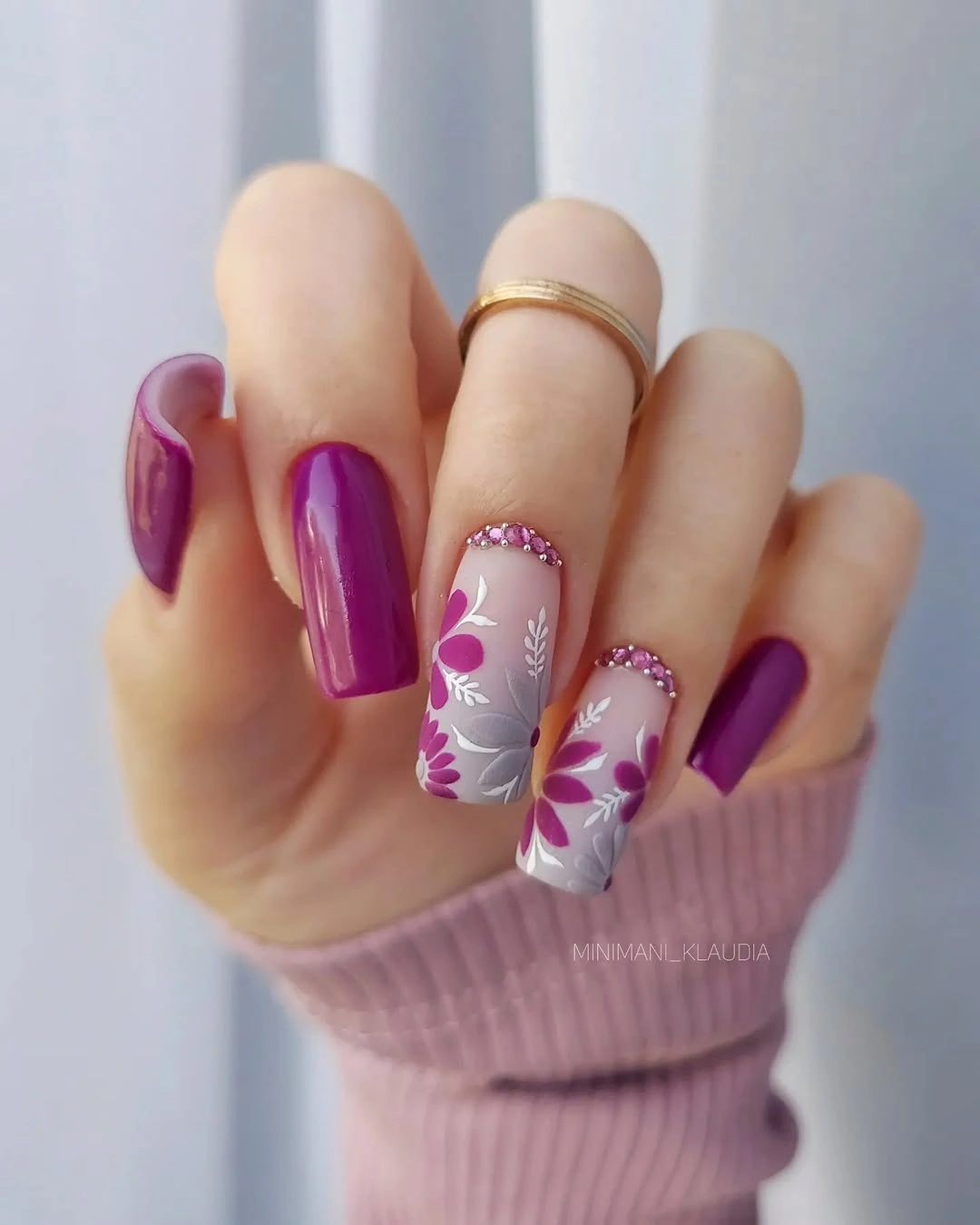 Long square violet nails with translucent pink and white floral accents