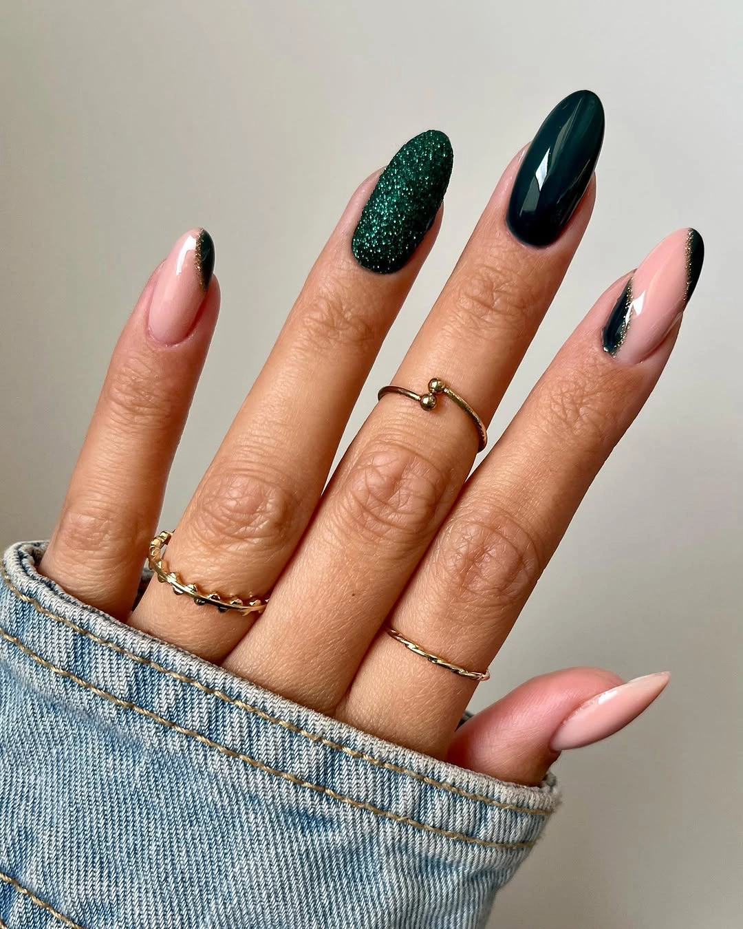 Long almond fall nails with dark green accents black tips and pale pink space