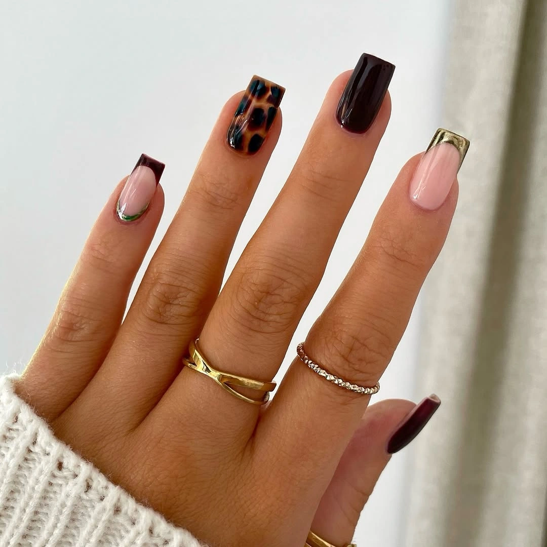Long mixed-shape fall nails with sheer pink brown gold and mottled accents
