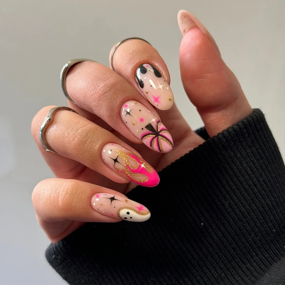 Medium almond nude nails with pink tips and tiny flowers