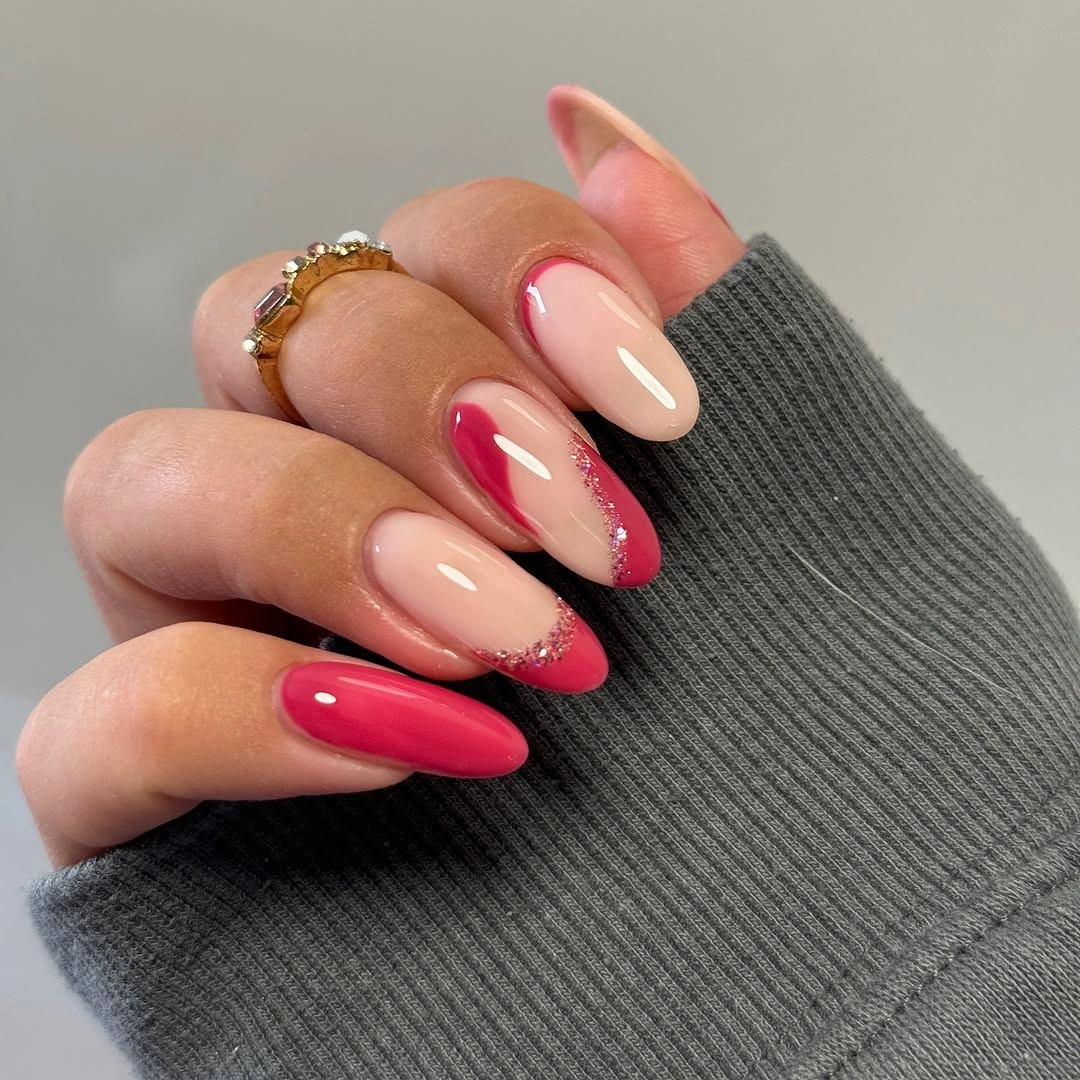 Medium almond nude nails with vivid pink tips