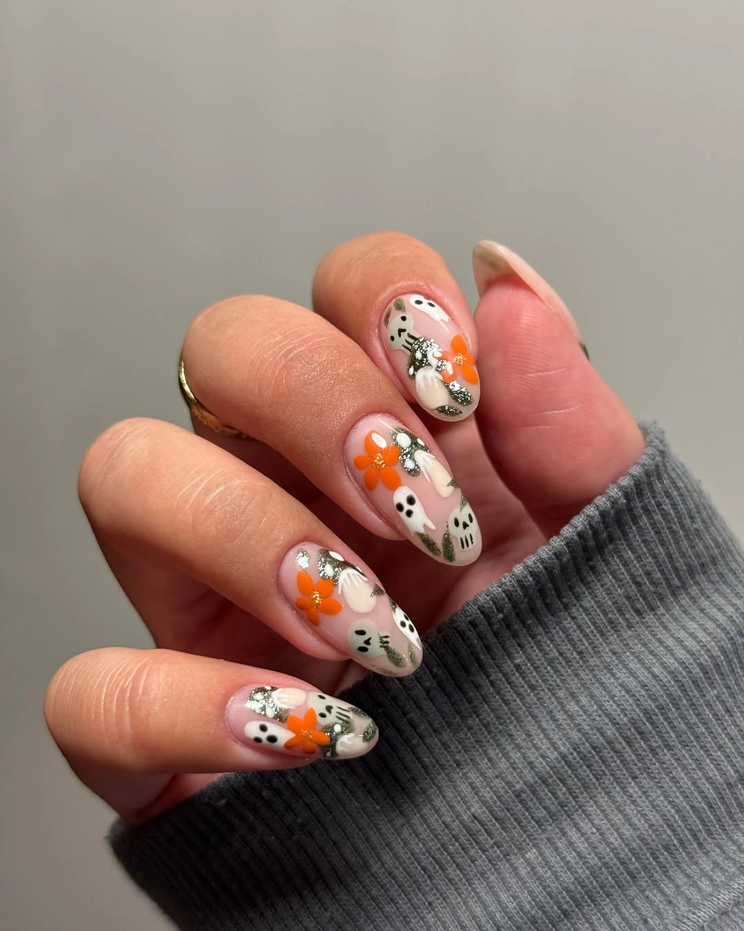 Medium almond pale nails with orange green mini florals